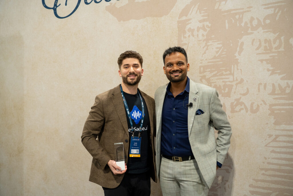 Sami Hilal, CEO of Sadie AI, poses with Neal Patel, Past AAHOA Chairman, after winning the AAHOACON26 Tech Pitch Competition.